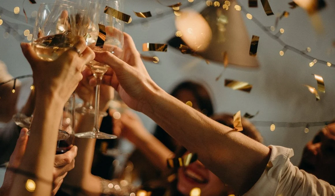 people toasting wine glasses